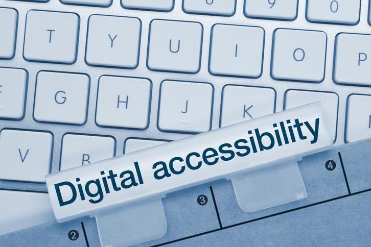 A picture of a keyboard overlaid with text that says "Digital accessibility"